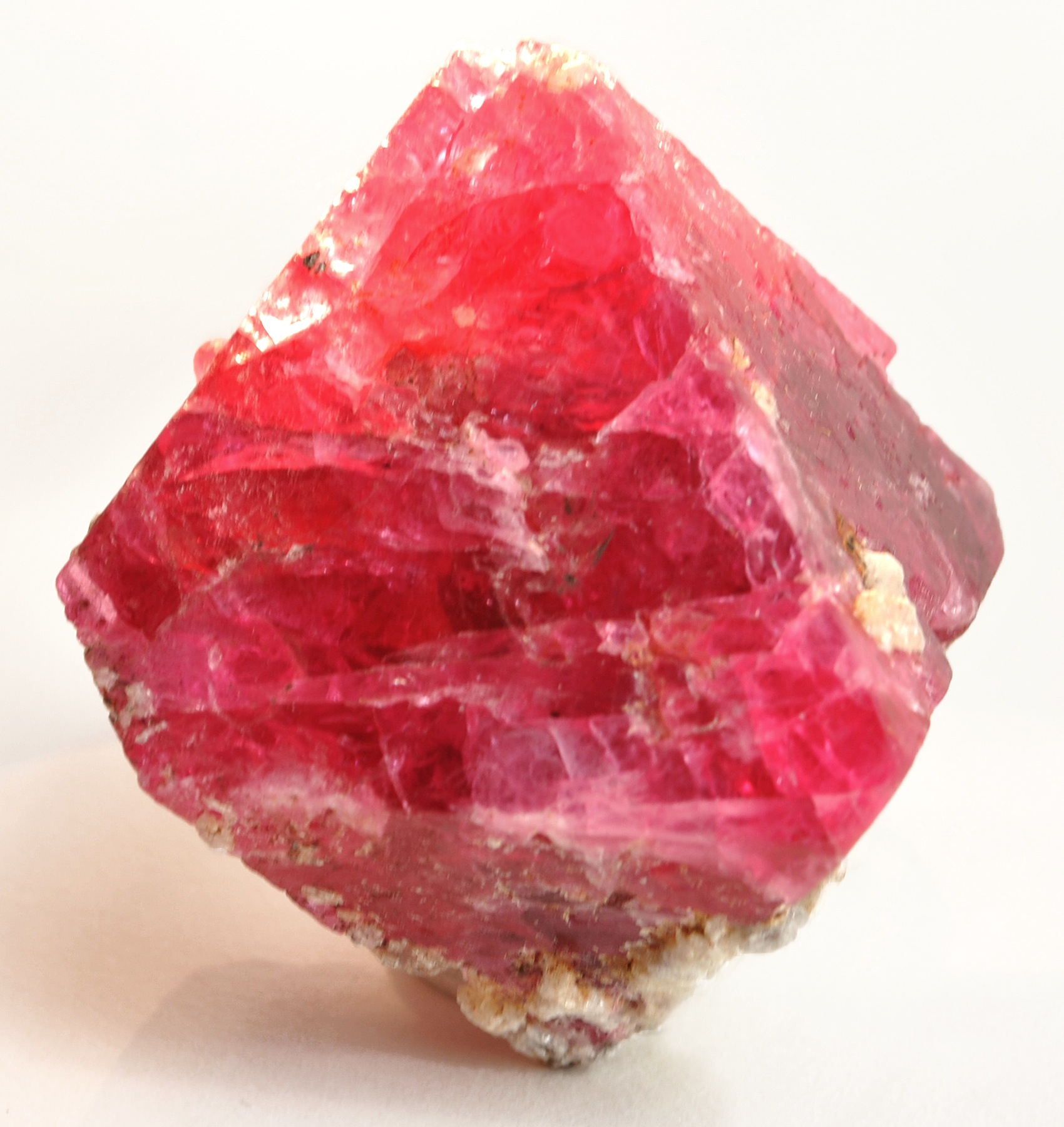 A large red octahedral spinel crystal.