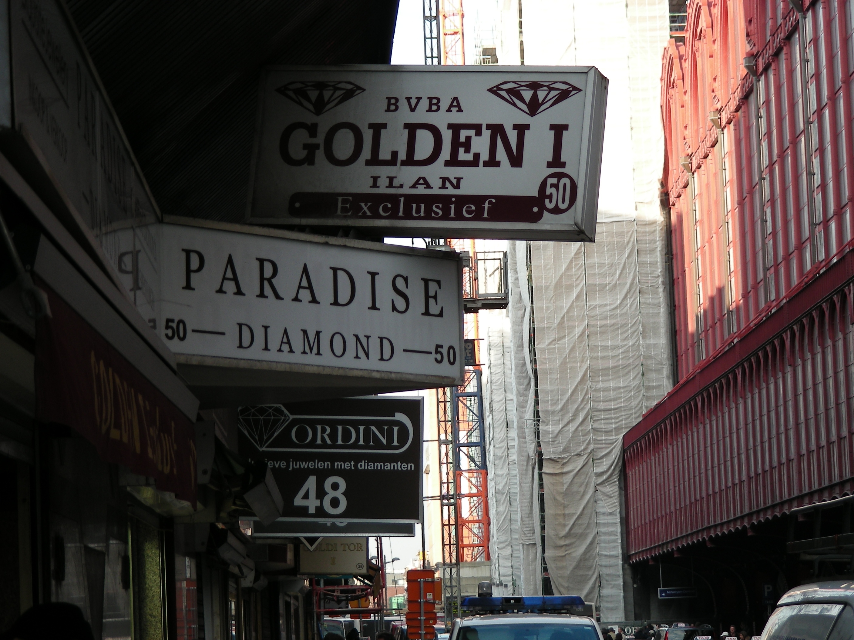 Diamond dealer signs on a narrow Antwerp street.