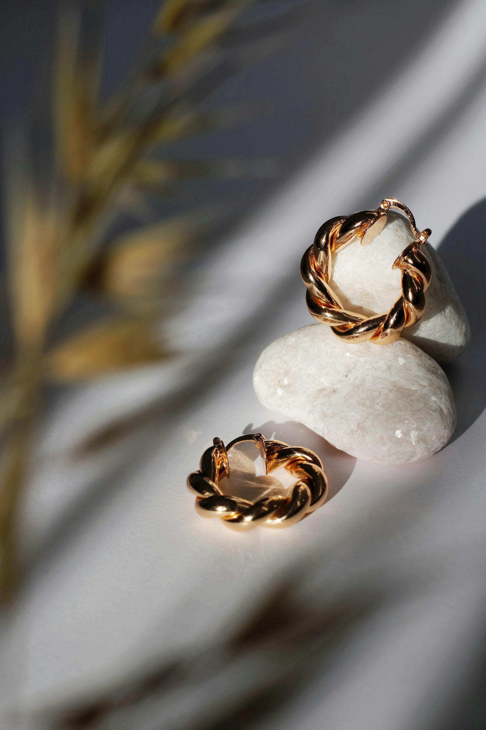 Two gold hoop earrings.